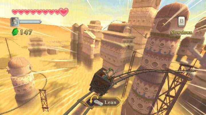 Link riding a minecart in the desert.