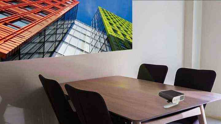 ViewSonic M1 portable business projector on a boardroom table.