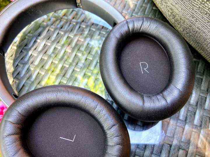 JBL Tour One wireless noise canceling headphones earcups close-up.