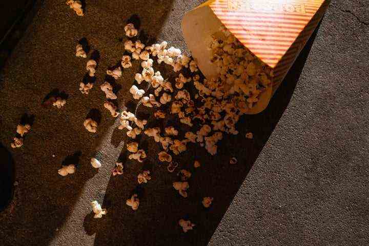 An image of popcorn spilled on a movie theater's floor.