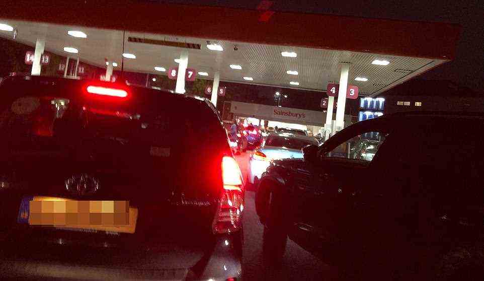 Drivers queued throughout the night to fill their cars with petrol. Pictured, queues at Sainsbury's Alperton petrol station at 5:45am as the issue continued
