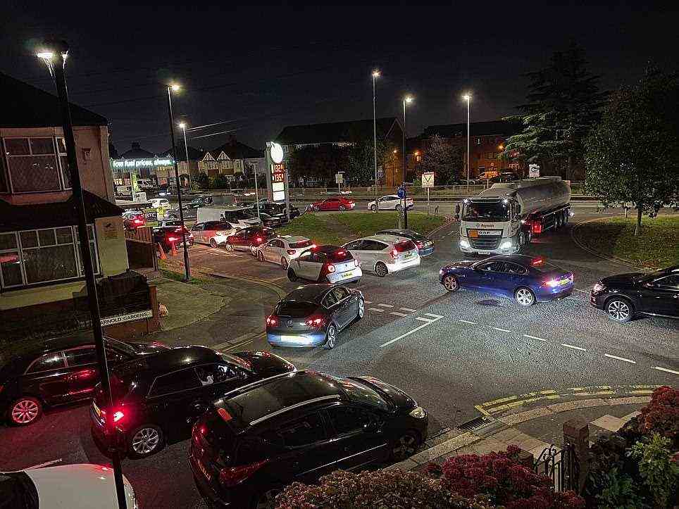Queues have continued overnight and this morning at this Apple Green petrol station at Palmers Green in North London as motorists leave the A406 to fuel up