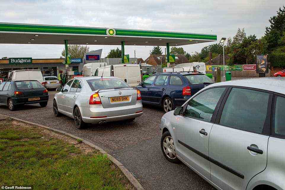 Queues at the BP petrol station in Soham, Cambridgeshire, at 8am on Saturday morning as the panic buying continued