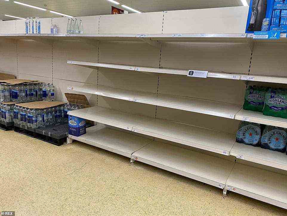 SAINSBURY'S: LONDON: Bottled water shelves in a Sainsbury's store in London were low on stock on Friday as the HGV driver crisis continues