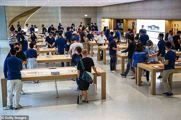 Inside the Singapore Apple Store on Friday where people try out the newly released products