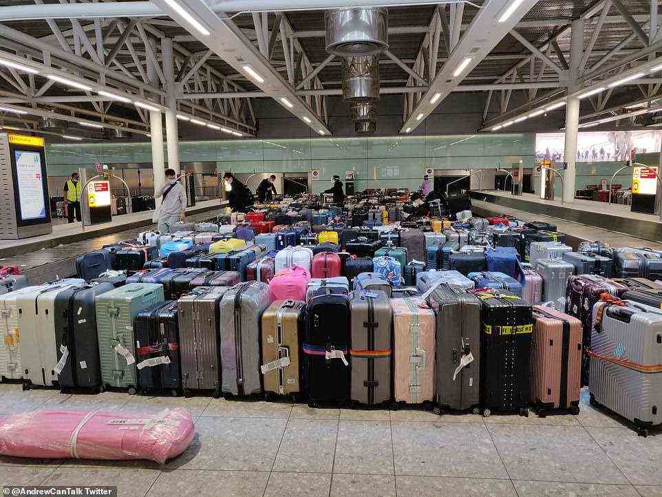 Due to the extensive queues, masses of luggage has been grouped together for people to sift through once they've made it through the border control as the baggage handlers try to keep up with the constant stream of inbound flights to Heathrow