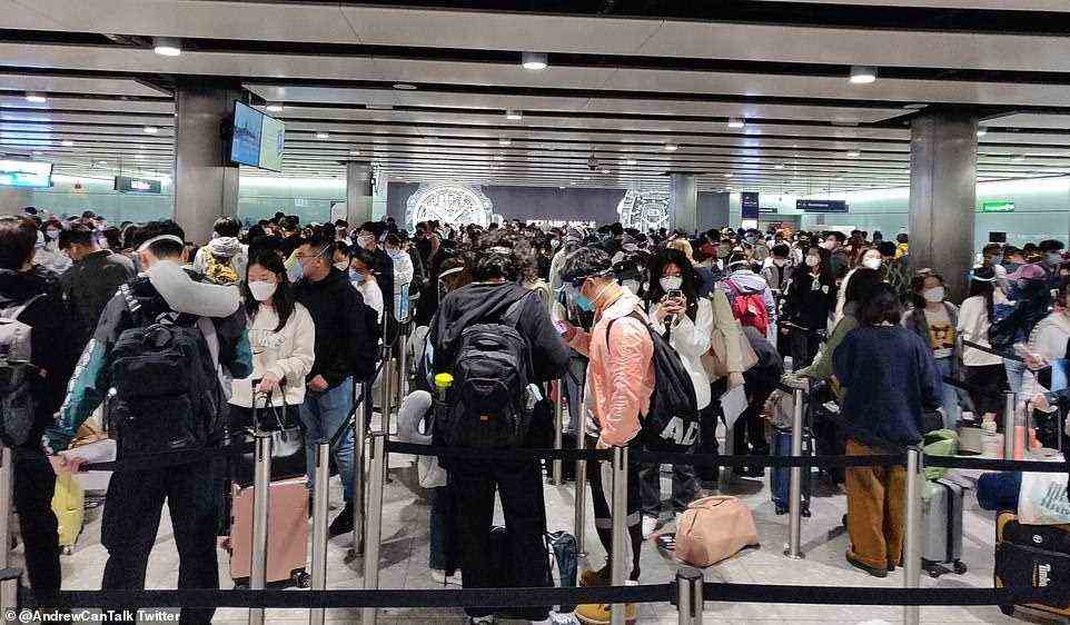 Passengers queue in their 'thousands' with minimal social distancing at border control, as they wait to prove their Covid travel status before entering the UK. Some have counted just six processing officers and several closed customer counters