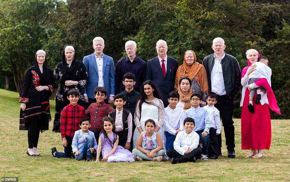 A British family with 15 albino members have revealed they've endured discrimination and abuse throughout their lives - but say their condition has brought them closer together. None of the most recent generation of the family (pictured front row) have inherited the condition.