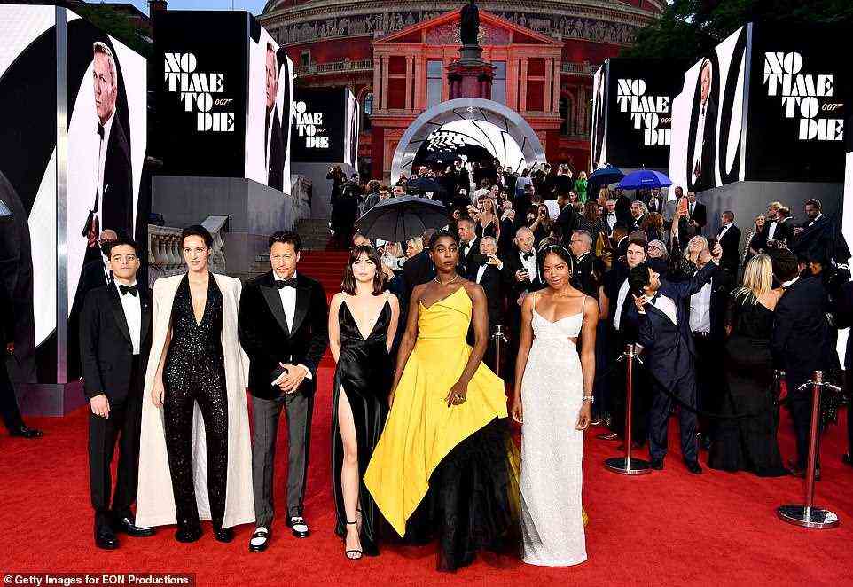 All together now: Team Bond cosied up for red carpet photographers