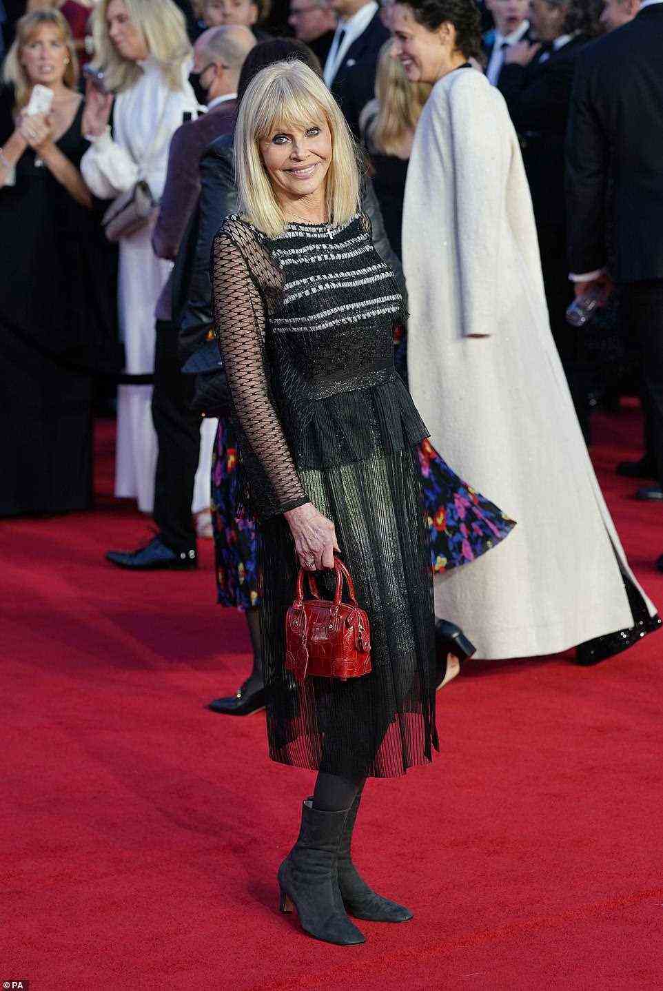 Timeless: Actress Britt Ekland looked timeless in a semi-sheer dress and suede black boots
