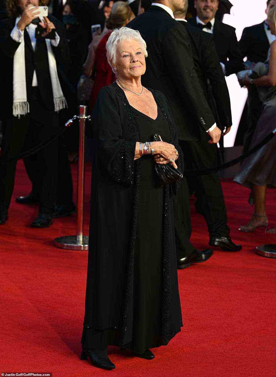Icon: James Bond icon Judi Dench was among the stars on Tuesday, and wowed in a glittering black jacket