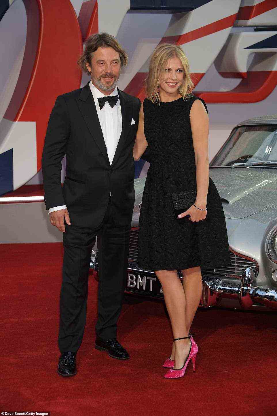 Sharp: Songwriter Jay Kay opted for a sharp suit and was joined by a glam female companion