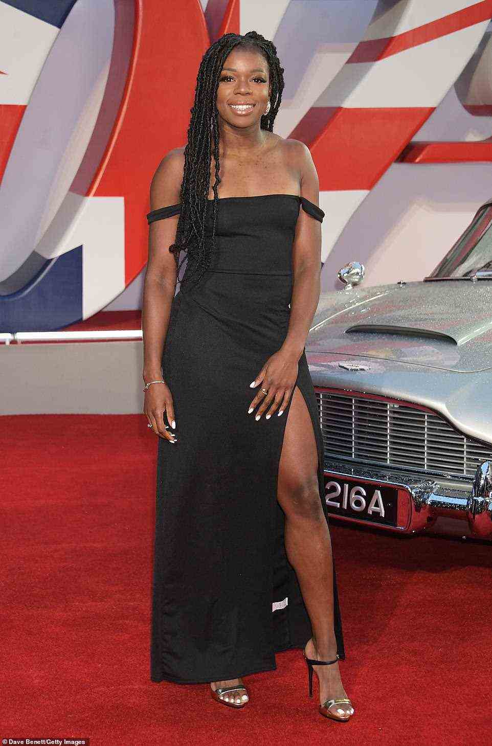 Striking a pose: Olympic athlete Asha Philip stuck a pose in a beautiful black gown complete with thigh-split