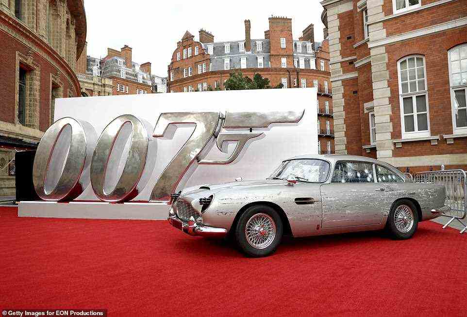 007: The Astin Martin was placed in front of a huge banner of Bond's codename