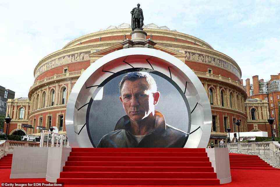 Man of the hour: A giant poster of Daniel Craig as Bond adorned the entrance