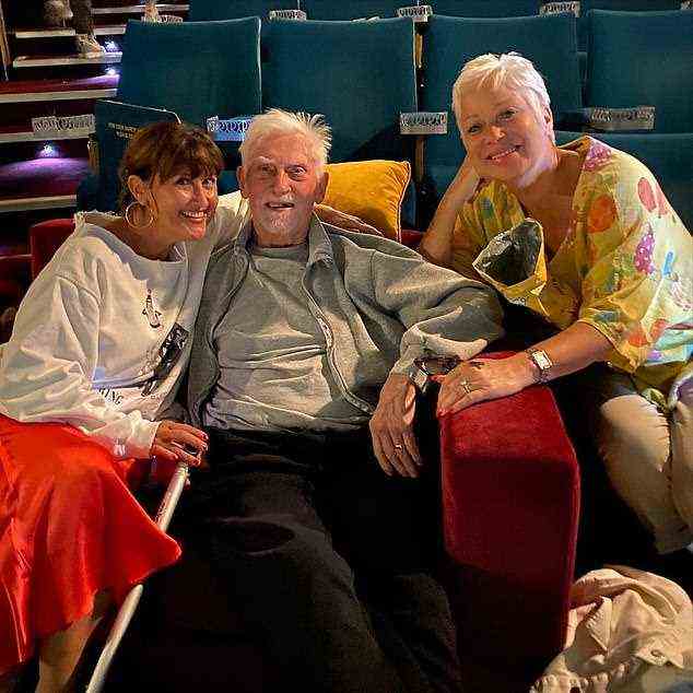 Together: Denise and her sister Debbie pose with their father Vin during a trip to the theatre