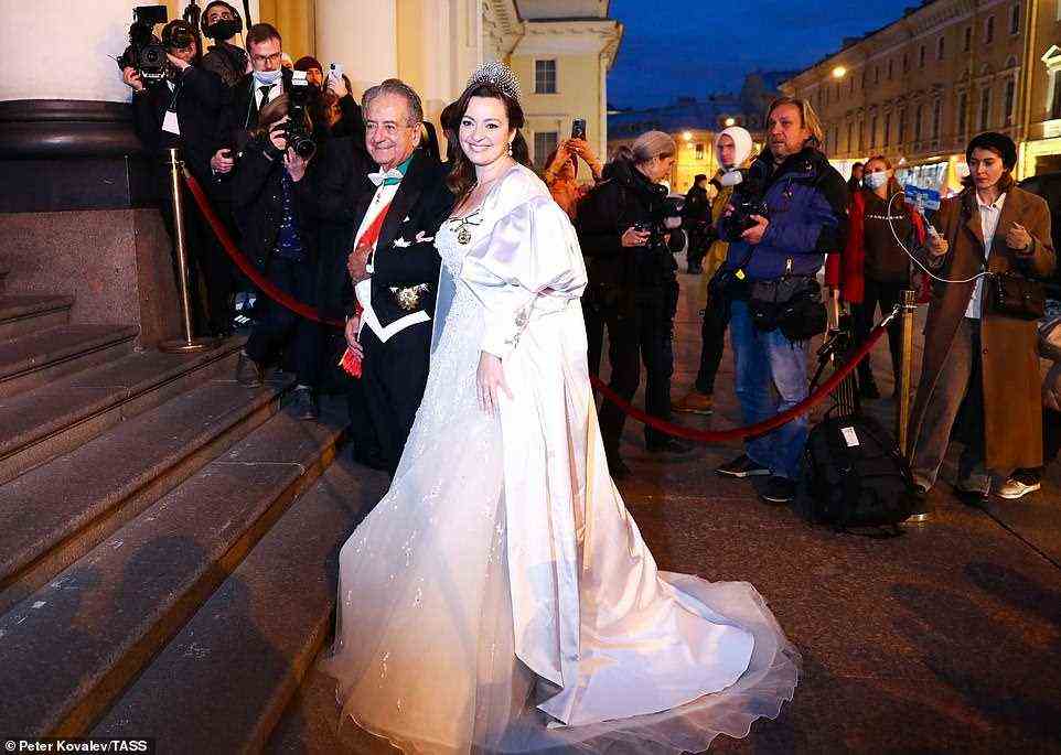 After the religious ceremony, the bride changed into a fairytale-inspired second wedding dress (pictured with her father Roberto) embellished with crystals to continue the celebrations at an evening gala at the Russian Museum of Ethnography