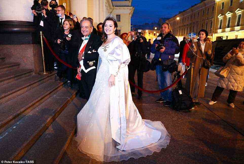 RebeccaBettarini of Italy is accompanied by her father, diplomat Roberto Bettarini to a reception at the Russian Museum of Ethnography marking her wedding with Grand Duke George Mikhailovich of Russia,