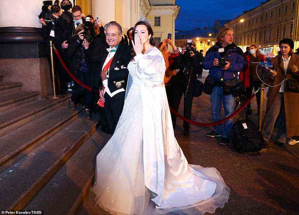 Rebecca Bettarini of Italy is accompanied by her father, diplomat Roberto Bettarini prior to a reception at the Russian Museum of Ethnography
