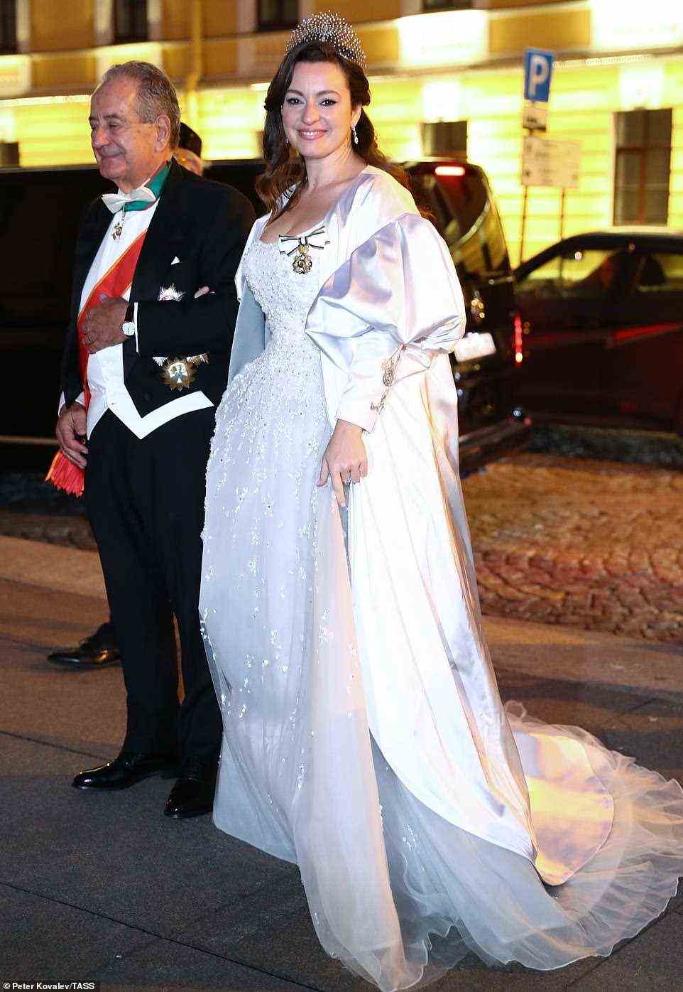Rebecca (Victoria) Bettarini of Italy is accompanied by her father, diplomat Roberto Bettarini prior to a reception at the Russian Museum of Ethnography marking her wedding