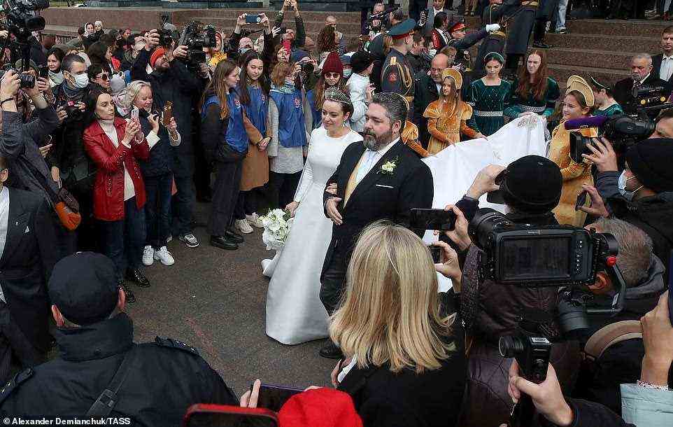 The couple were greeted by a crowd and media who snapped pictures of the newlyweds moments after they tied the knot