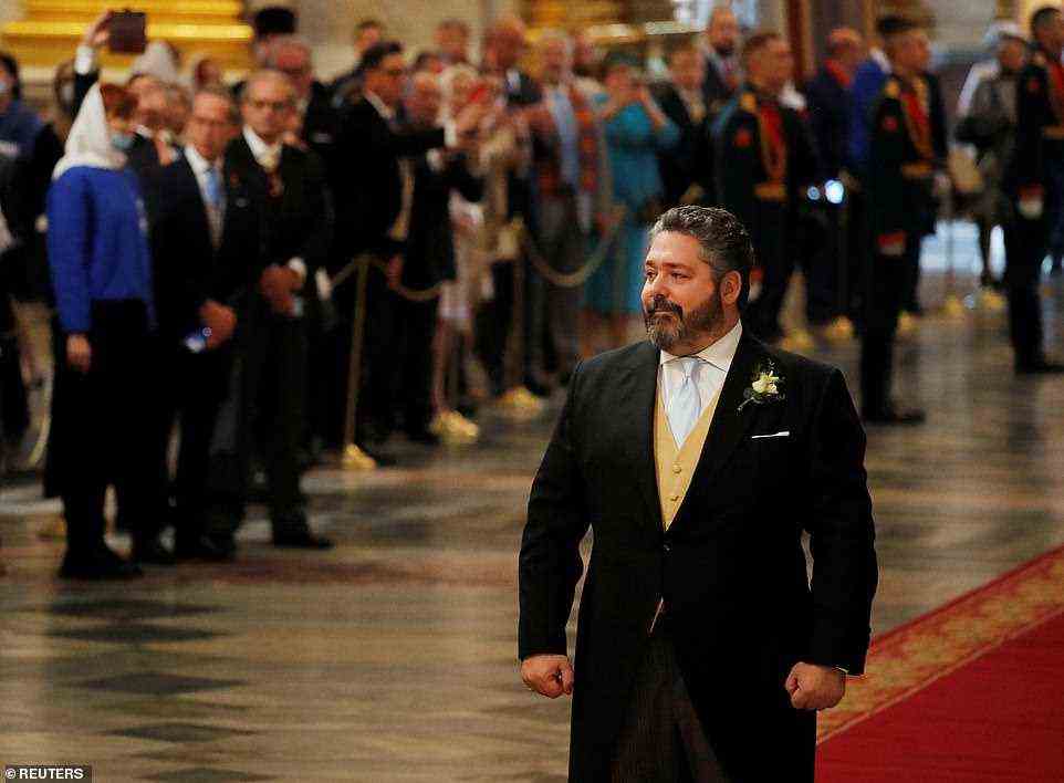 Grand Duke George Mikhailovich Romanov could be seen smiling as he arrived for his wedding ceremony to Victoria Romanovna Bettarini at St. Isaac's Cathedral