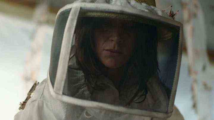 Suliane Brahim in a beekeepers suit in The Swarm.