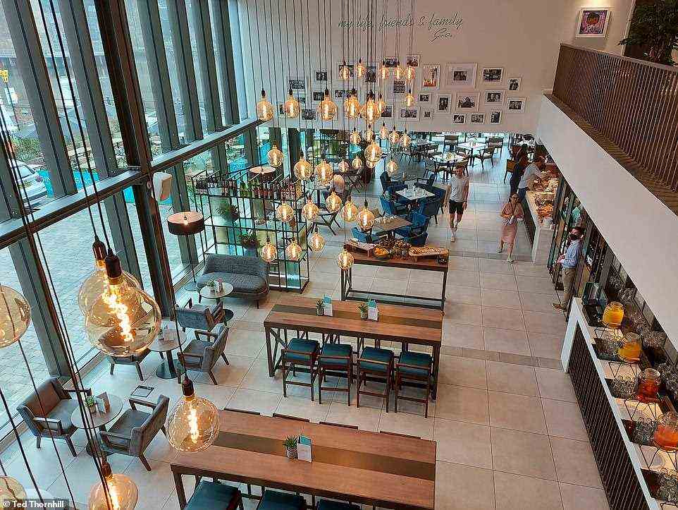 The windows, along with the double-level atrium design of the bar, give the downstairs space a wonderfully light and airy ambience