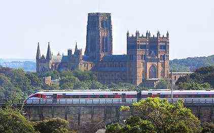 An LNER Azuma glides past Durham Cathedral
