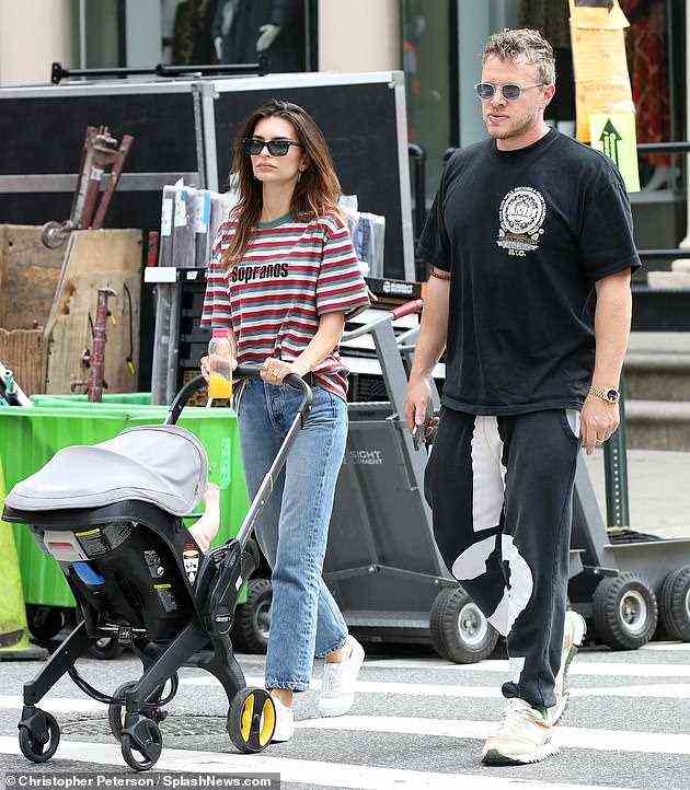 Standing tall: Emily Ratajkowski, 30, kept her head high as she stepped out in New York on Sunday with husband Sebastian Bear-McClard and their son Sly, six months