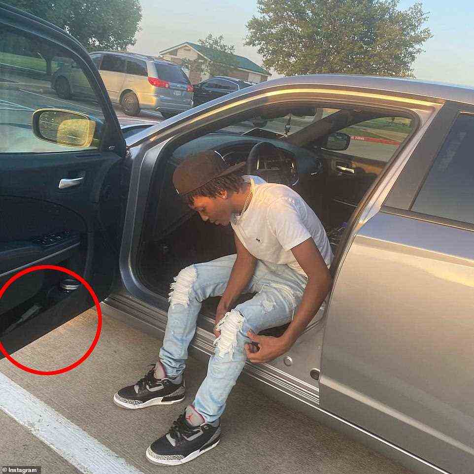 Timothy Simpkins, 18, is shown in his Dodge Charger in a recent social media post. In the side of the car, what looks like a gun is visible. The teenager opened fire in school on Wednesday, shooting at least two people. No one died but some are in a critical condition. His family say he was being bullied in school and he lashed out in self-defense. The school is yet to confirm if they received any reports of the bullying