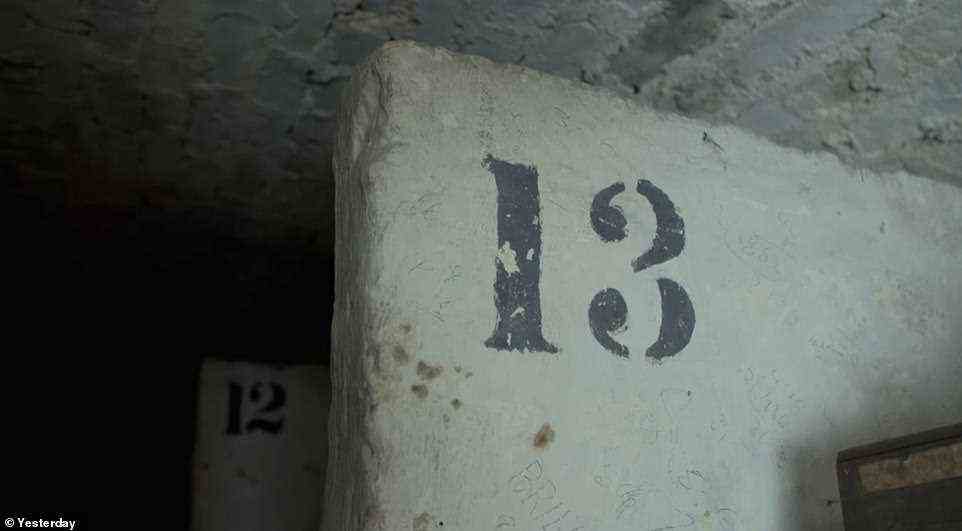 Numbered concrete partitions give a hint as to how the space would have once been packed with caskets of wine. Now, only some of the dusty caskets remain