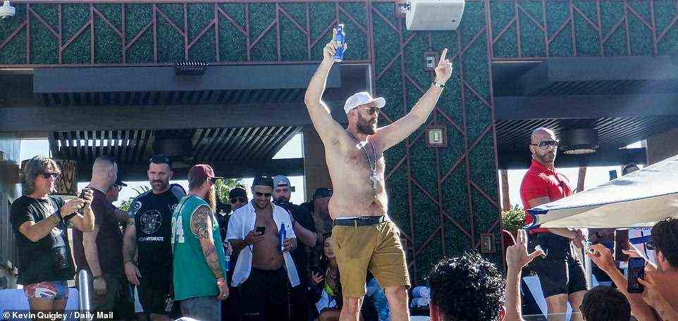 Here we go: Shirtless Fury held his arms aloft while attending the wild outdoor party in Las Vegas on Sunday