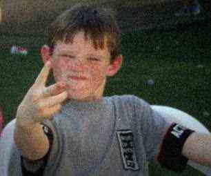 Shocking: A young Rooney is pictured swearing to the camera during his childhood in Croxteth, Liverpool