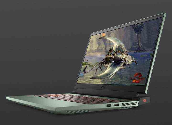 Dell G15 gaming laptop with pc video game scene on screen of a dragon, on grey background
