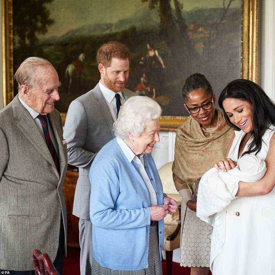 Prince Harry and Meghan Markle have indicated they are still considering whether their daughter Lilibet will be christened in the UK (pictured with the Queen, the Duke of Edinburgh and Meghan's mother Doria Ragland during Archie's christening)