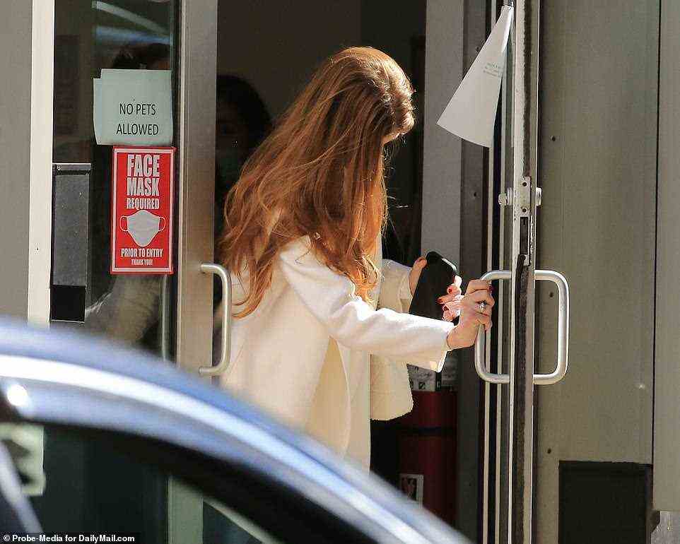 Jennifer leaves Salon M after getting a red manicure and pedicure for her wedding day