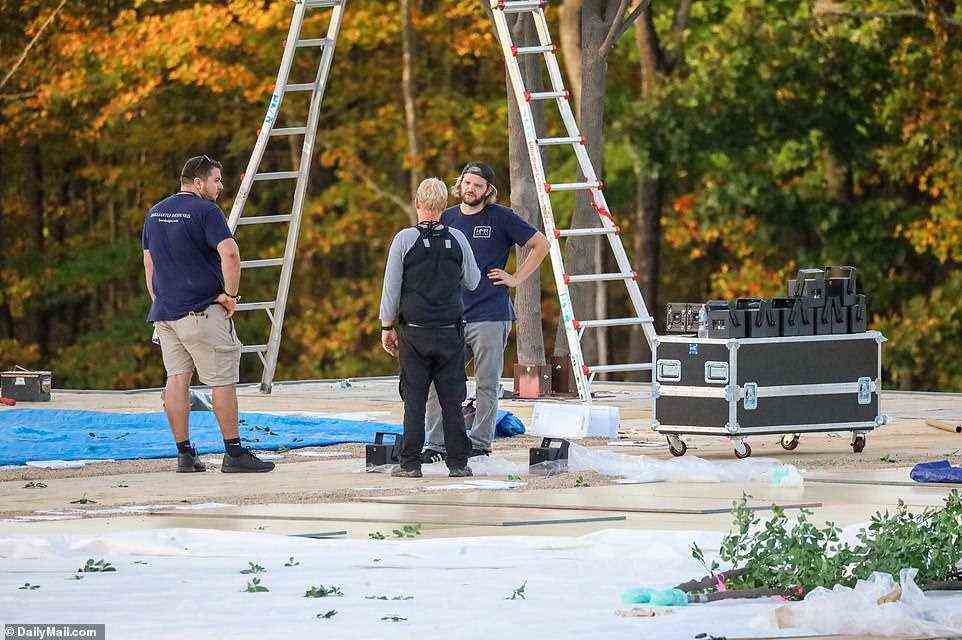 Workers were seen at Jennifer's farm on Thursday, erecting what appeared to be a wooden platform or dancefloor, created around the trees