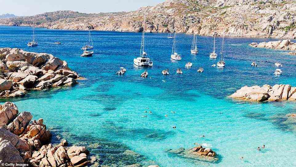 La Maddalena has some of the cleanest and clearest waters in Italy, as well as magnificent beaches that feel more Caribbean than Mediterranean. The island is connected by a small bridge to the wild island of Caprera. Pictured, Cala Coticcio bay on the northeastern part of Caprera