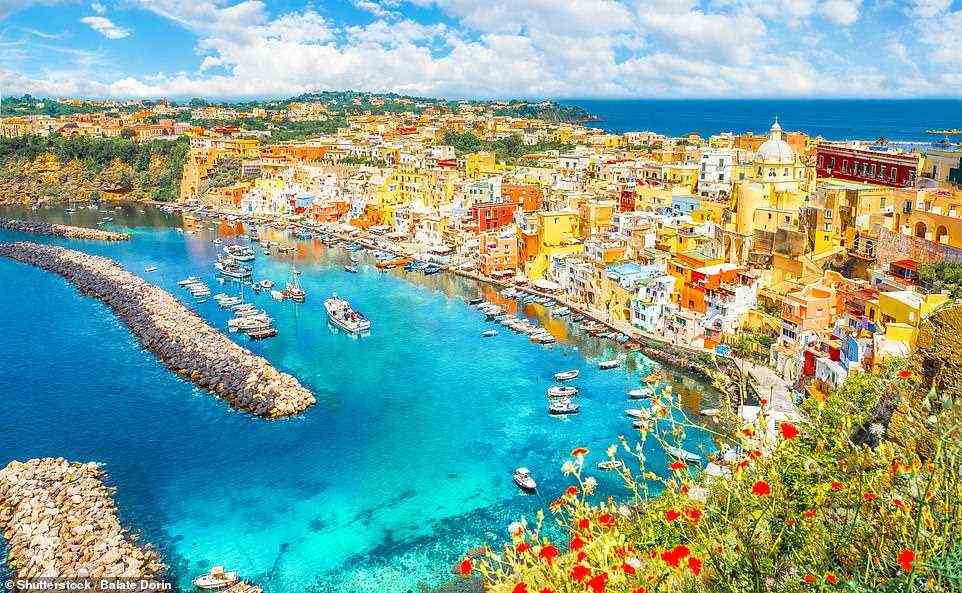 Refreshing: The harbour at Procida, which is an island famed for fragrant lemons that 'grow as big as fists on trees between buildings dripping with bougainvillea'