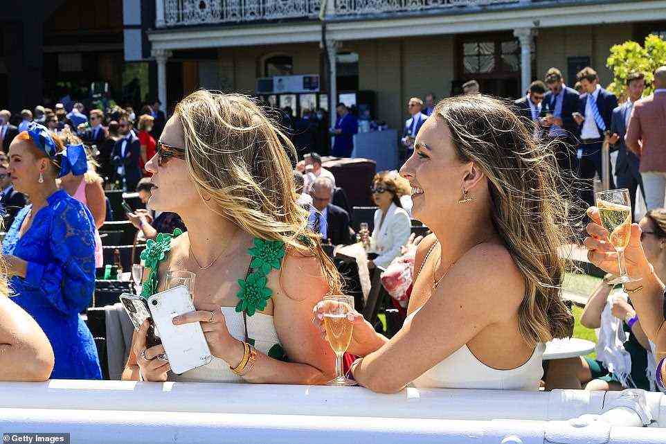 Racegoers are seen on the edge of the track at the Royal Randwick Racecourse on Saturday as freedom finally returns to Sydney