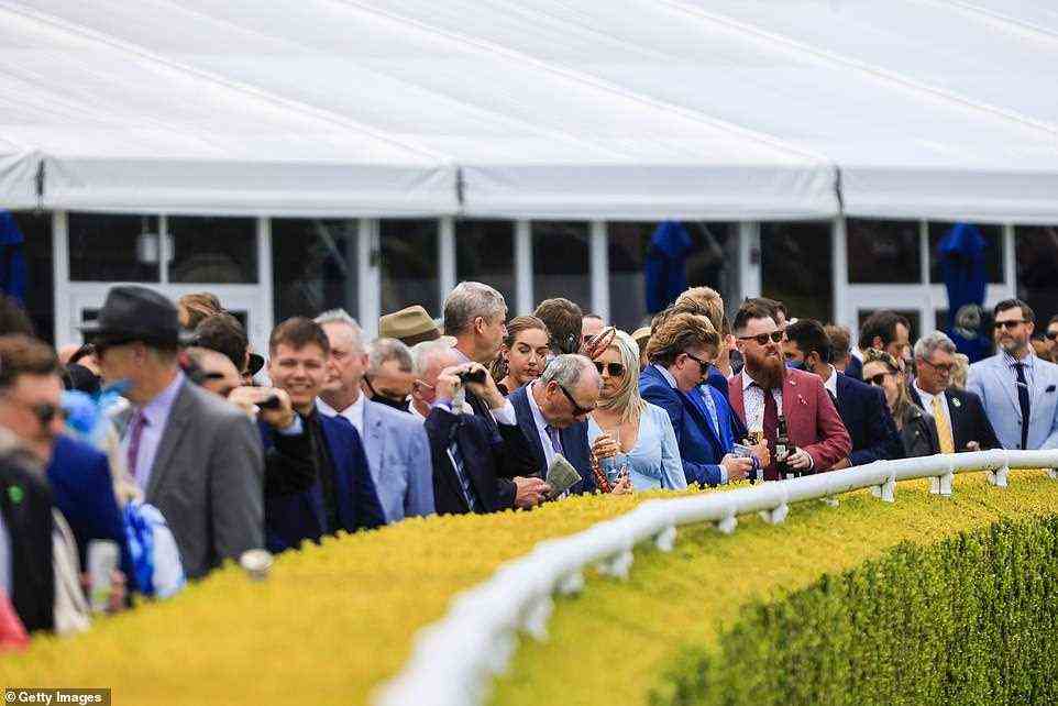 Crowds of punters are seen watching on as the races kick off at The Everest on Saturday
