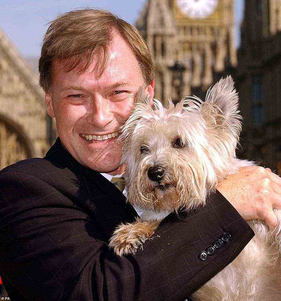 Animal lover: MP, who campaigned against fox hunting, with pet in front of Houses of Parliament