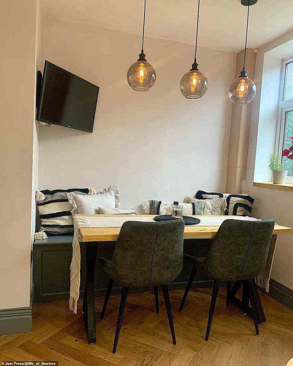 Their dining-table in now nestled into a corner of their open-plan kitchen. They opted for a trendy booth-style sitting area with a bench and cushions, pictured after