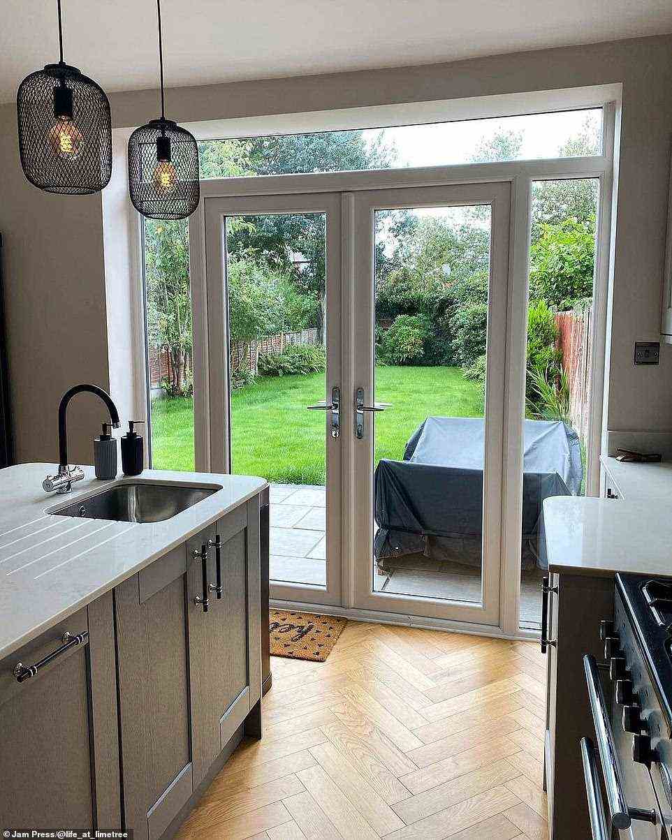 The new bay windows, which open to the garden and offered plenty of light. The central island of the kitchen offers extra storage too, pictured