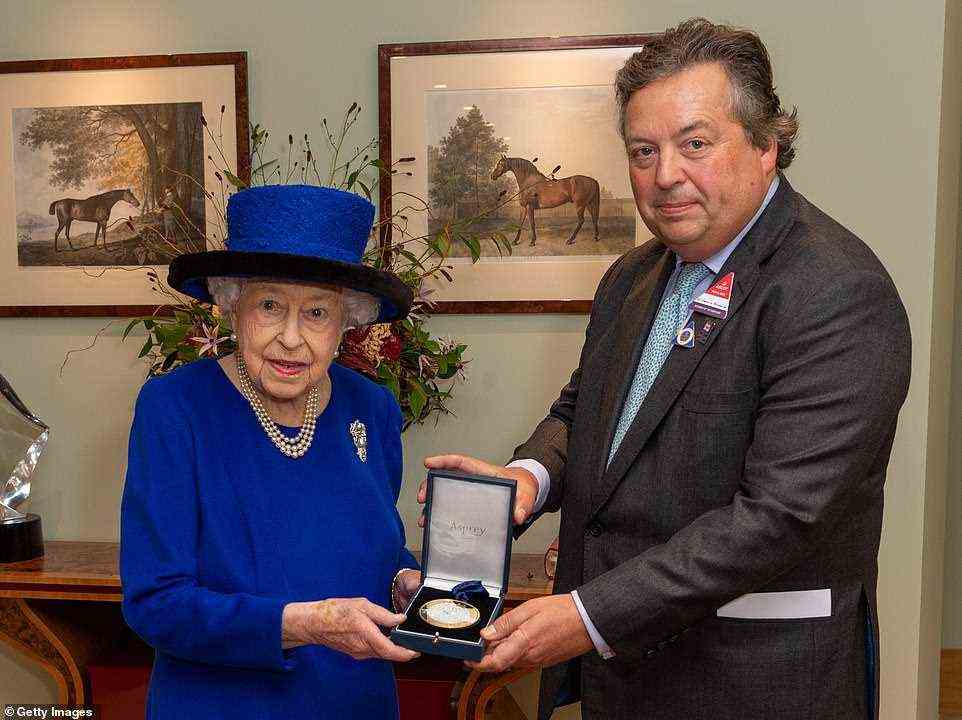 The Queen receives a special memento from Her Majesty's Representative at Ascot, Sir Francis Brooke Bt., to mark her induction into the British Champions Series Hall of Fame, the official Hall of Fame for British Flat racing