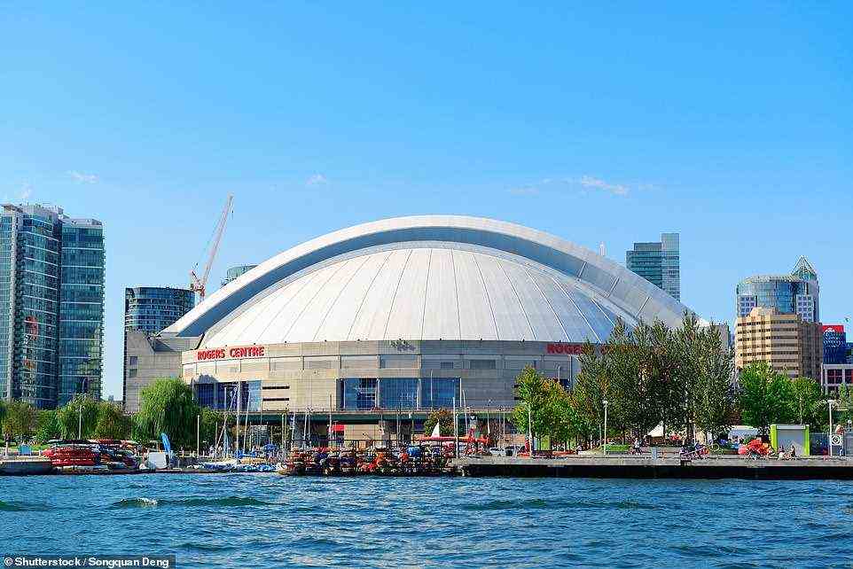 Stuart recommends watching a Blue Jays baseball game at the Rogers Centre, pictured above, for a 'thoroughly Torontonian experience'