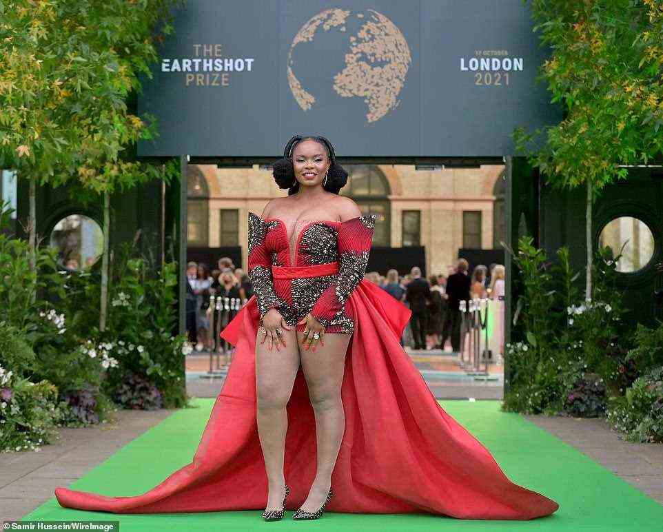 Nigerian Afropop star Yemi Alade, 32, turned heads in a dramatic red mini playsuit with a statement skirt cape