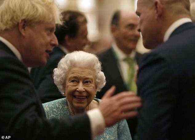 As guests mingled amongst themselves, the Queen could be seen grinning from ear-to-ear