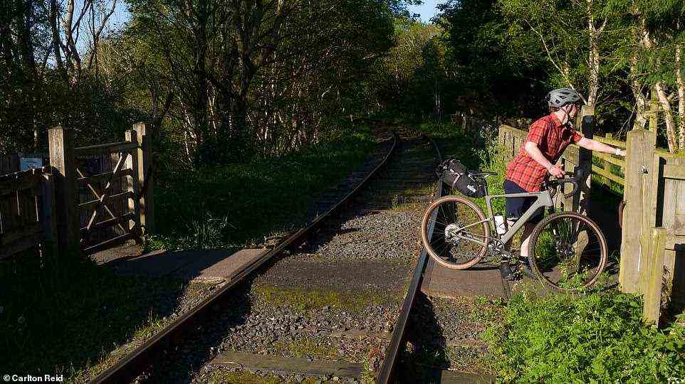 Carlton Reid crossing the Tanfield Railway near Causey Arch - a line kept alive by volunteers. Mountain bike shirt by Club Ride